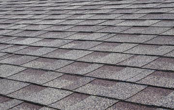 Discoed tiles for shallow pitch roofing
